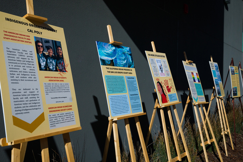 A series of easels display posters with information on local Indigenous and Native communities.