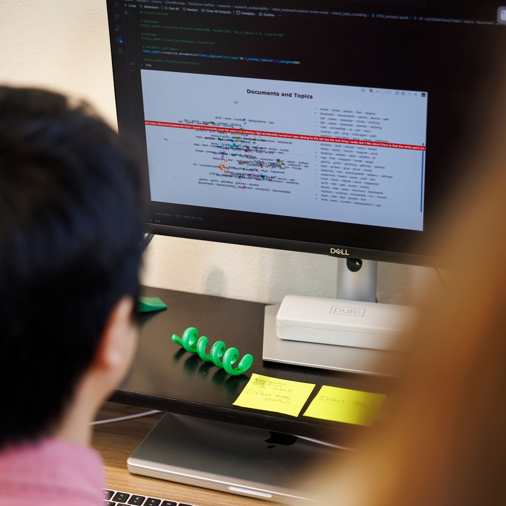 A professor looks at a natural language processing tool on a computer screen