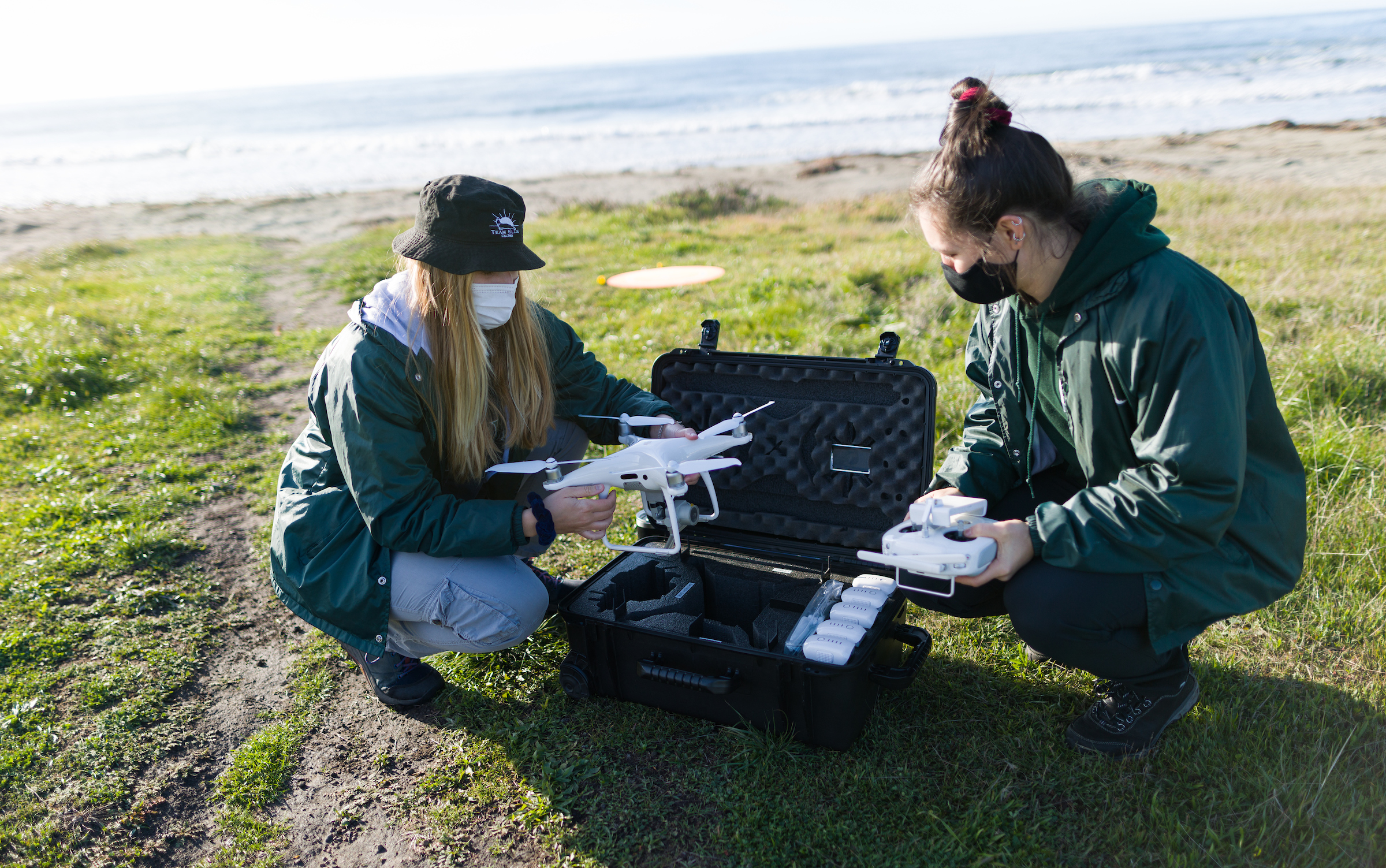 Graduate students Kate Riordan and Molly Murphy start setting up the aerial drone for surveys. NMFS permit #22187-02