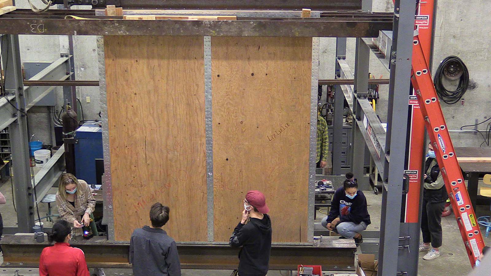 Cal Poly ARCE Students prepare for a shear wall test. 