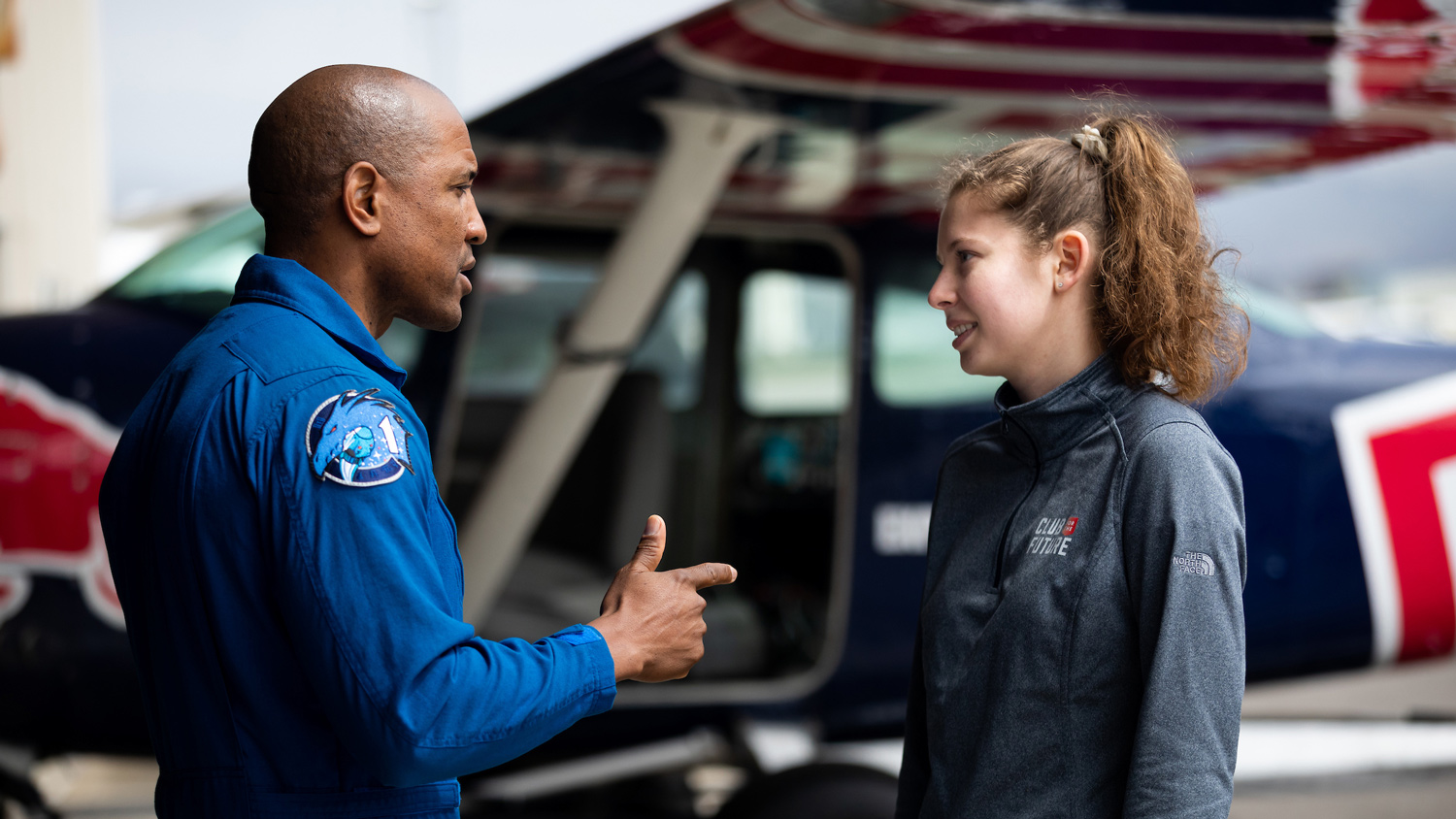 Glover talks with aerospace engineering student Claire Luce, who is part of the Project Mobius team at a San Luis Obispo Regional Airport hangar. 