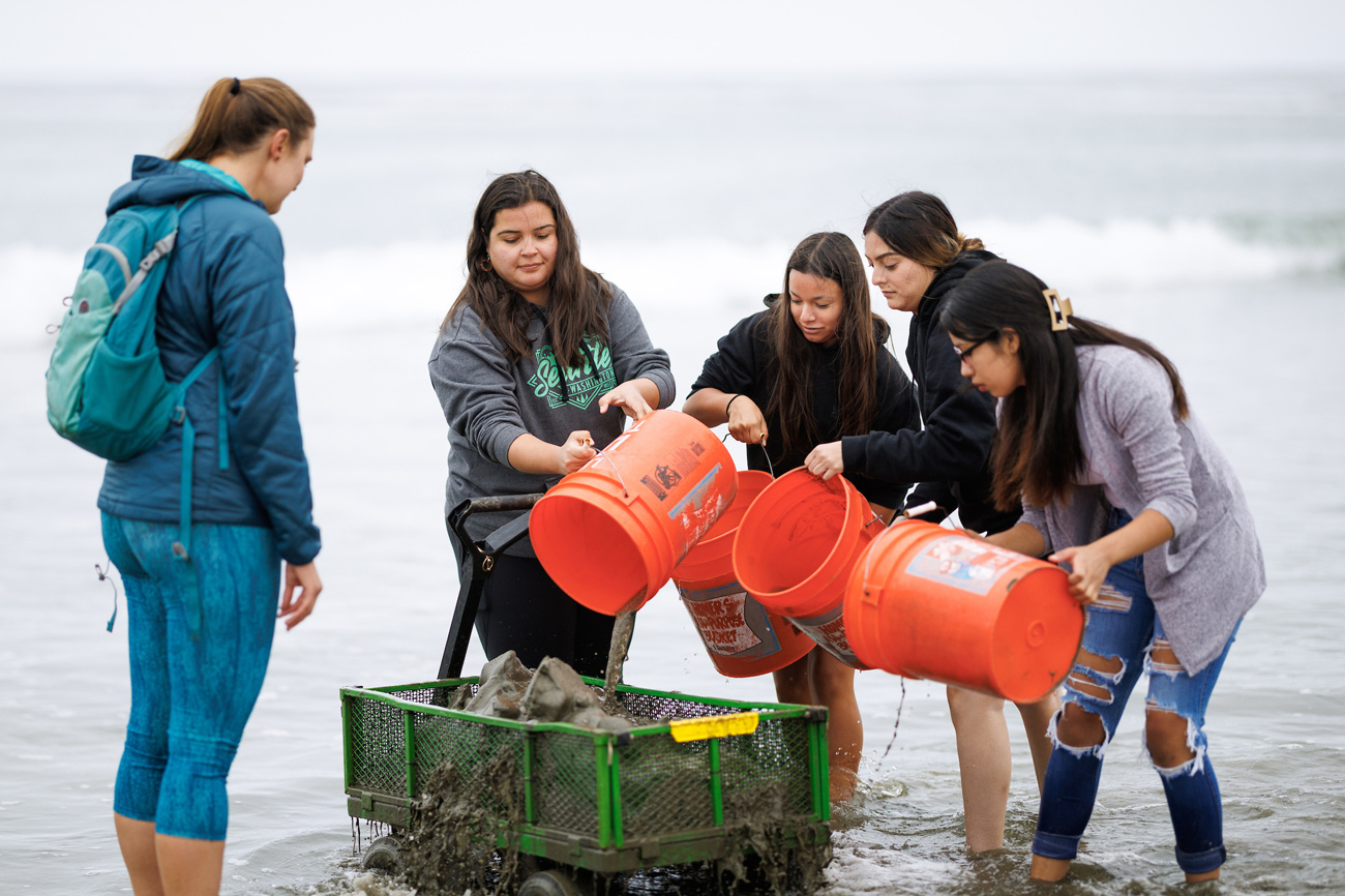 Lindsay Learners filter sand from the tidal zone to search for shellfish in Cayucos.