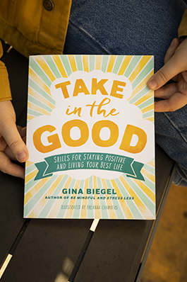 A close-up of the cover of the book, "Take in the Good."