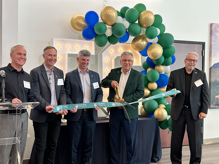 Cal Poly President Armstrong, Cal Poly Vice President of Information Technology and Chief Information Officer Bill Britton, and others cut a ribbon in front of large letters spelling 5G