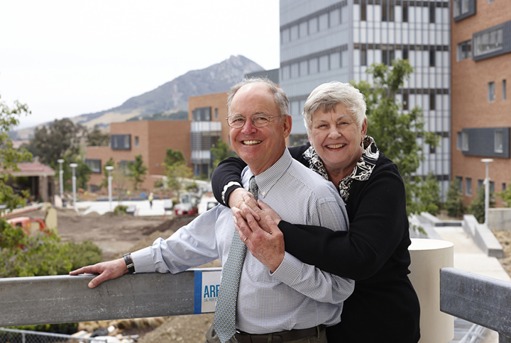Philip and Christina Bailey pose on the Cal Poly campus with the Baker Center for Science and Mathematics in the background.