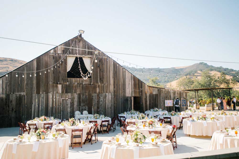 The barn at the Higuera Ranch in San Luis Obispo, shown with tables and chairs ready for an event..