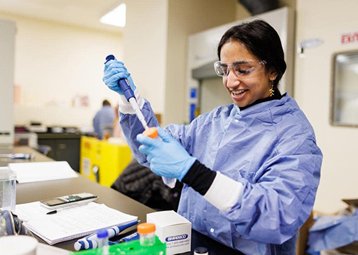 A graduate student conducts experiments in a biomedical engineering lab