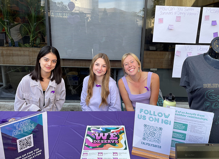 Safer staff Victoria Munoz, Caty Ogden, and Kallie Kidder at a Purple Thursday event in October 2022 in the University Union.