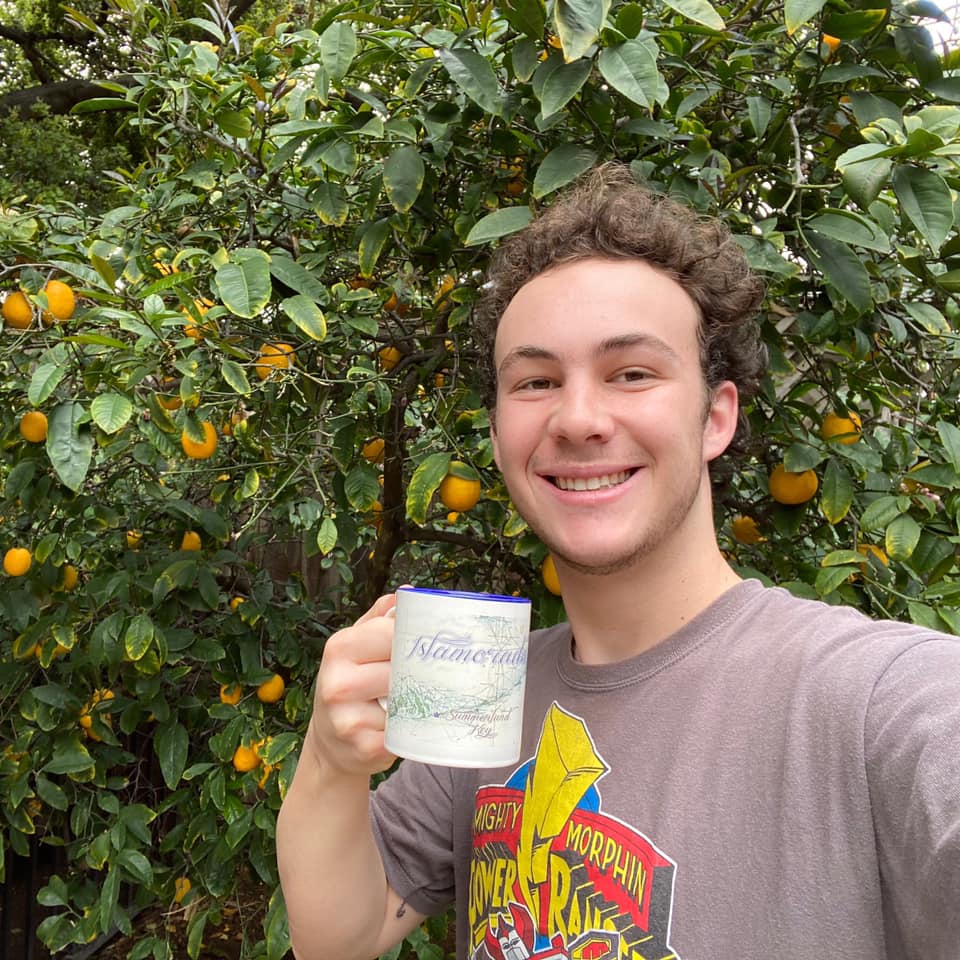 Student Chad McCormick takes a selfie with his mug of tea in San Jose. 