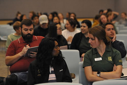 Two students discuss during a call called "Cal Poly Privilege: Investigating our Campus Demographics" at the fourth annual Teach In event at cal poly.