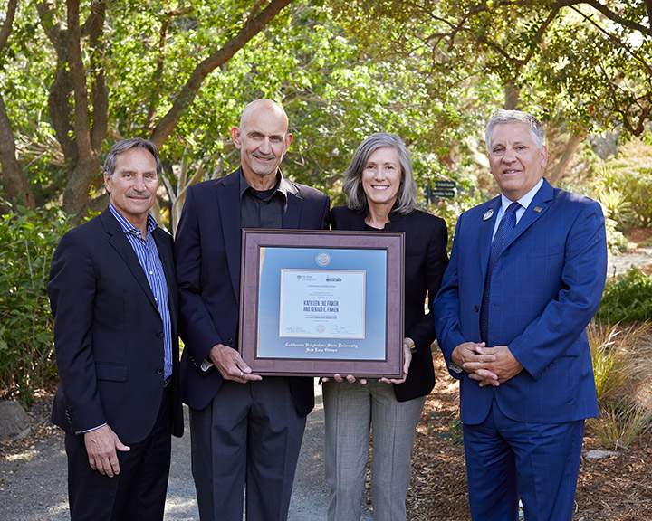 College of Agriculture, Food and Environmental Sciences Dean Andy Thulin, Kathleen Enz Finken, her husband, Gerald Finken, and President Armstrong