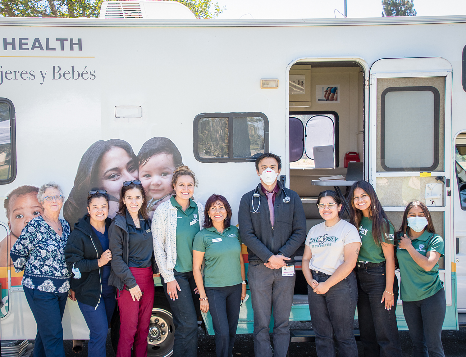 MHU Clinic and Staff. From left to right are Medical Director Vicki Charbonneau, nurse practitioner; Phlebotomist Rubi Solano, CPT-1; Director of Operations Suzanne Phelan, Ph.D.; kinesiology major Elena Kraemer, a Cal Poly Health Ambassador; Mobile Health Unit Coordinator Cristina Macedo, MSW; Dignity Health Resident Anthony Reyes, MD; public health major Nathalie Zamora, a Cal Poly Health Ambassador; public health major Isabella Araoz, a Cal Poly Health Ambassador; and Mixtec Interpreter Paola Ligario.