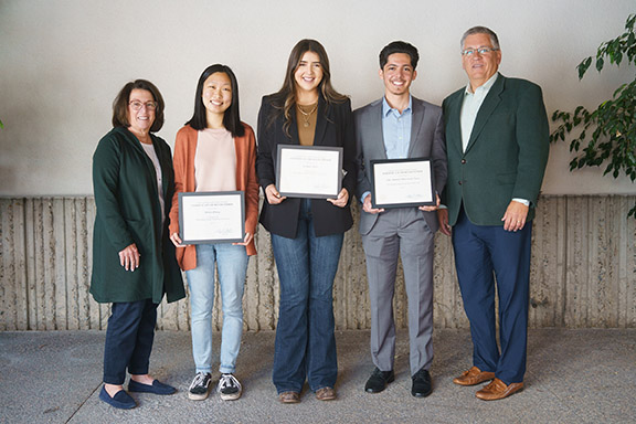 President and Mrs. Armstrong with Helen Zhang, left, Adrianna Arias, center, and Luis Plascencia, right..