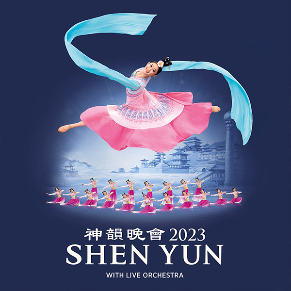 The Shen Yun logo is in the front with a dancer in a pink dress with big blue arm ribbons flying around her as she leaps in the air. There are more dancers behind her on the blue background.