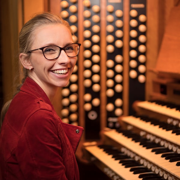 Woman smiling sitting at an organ