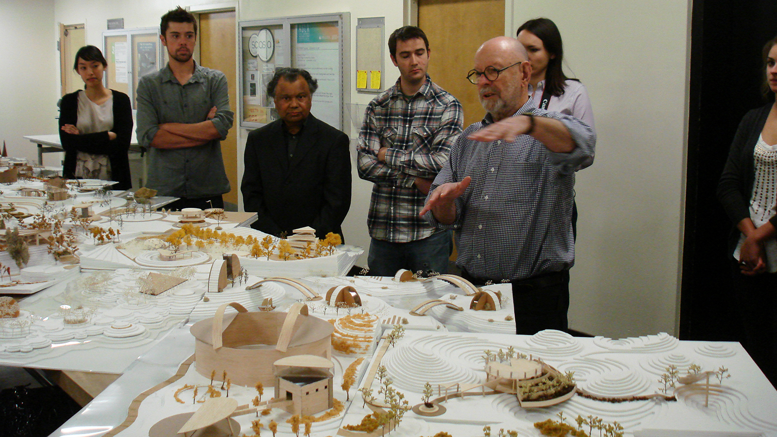 Landscape architecture professors observe student work in the studio