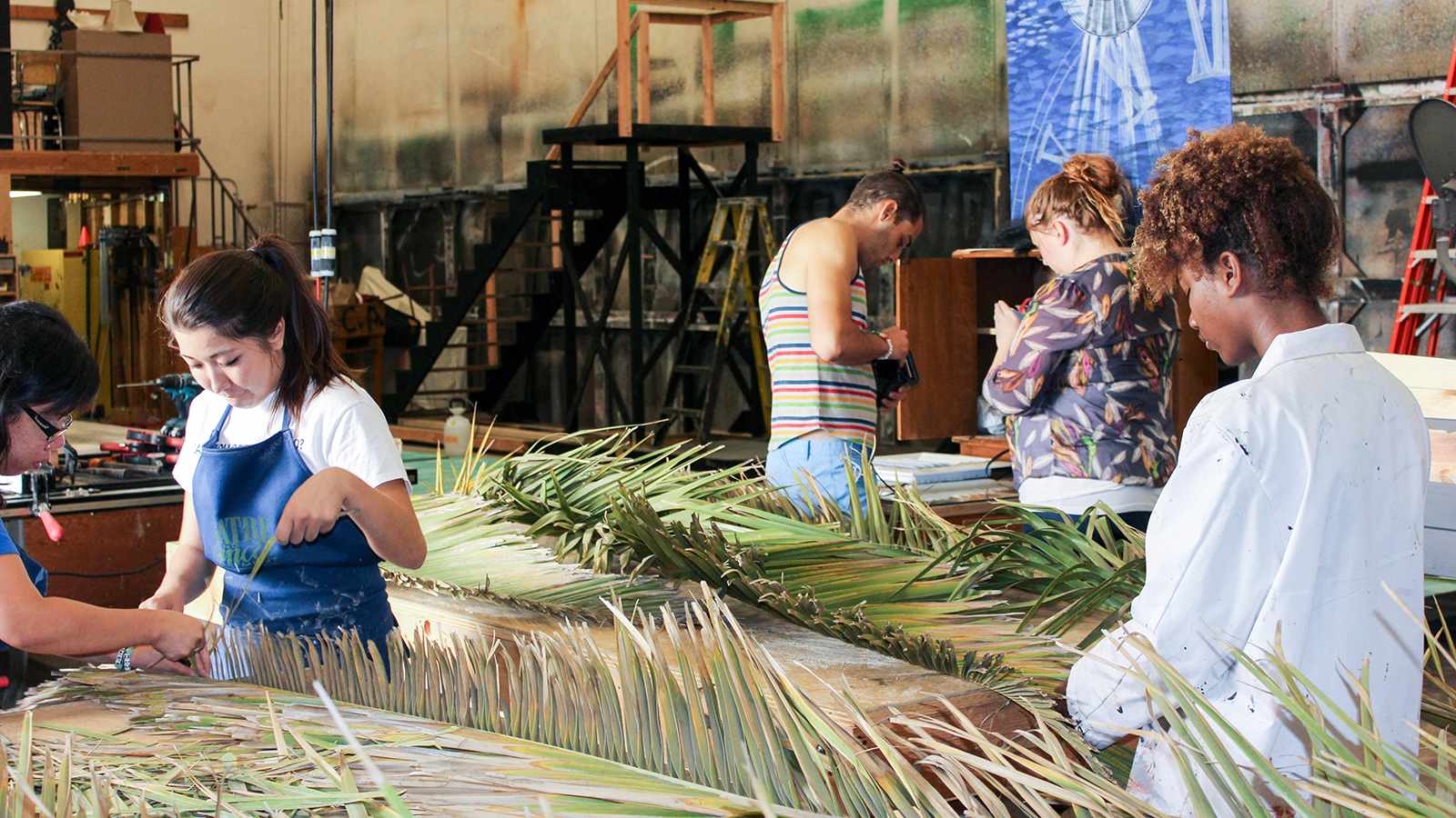 Students building a set for a theatrical production