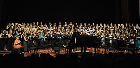 Cal Poly choral groups combine to fill the stage during a performance