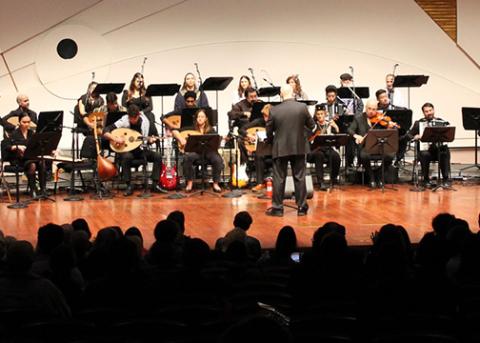 The Arab Music Ensemble performs on stage