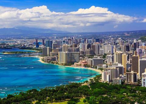 A view of Honolulu skyline showing the shore and downtown high rises on Oahu