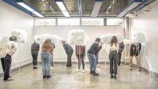 Students engage with Cal Poly architecture diorama project "Cloud 9." 