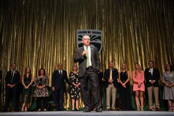 Cal Poly President Jeffrey D. Armstrong stands onstage. 