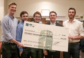 Five of the team that took first place at the 2019 Innovation Quest pose with an oversized check.