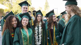 Graduates from Cal Poly's class of 2019 smile for the camera.