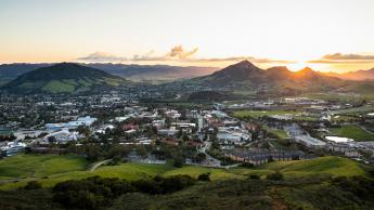 A panoramic photo of the Cal Poly campus at sunset