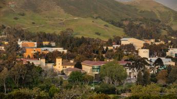 A wide shot of the Cal Poly campus buildings with the P on the hilside