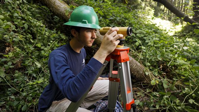 Student using survey equipment at Swanton Ranch