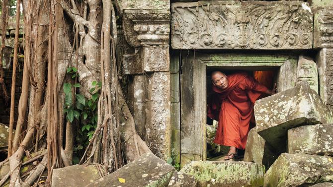Monk exploring Angkor Wat
