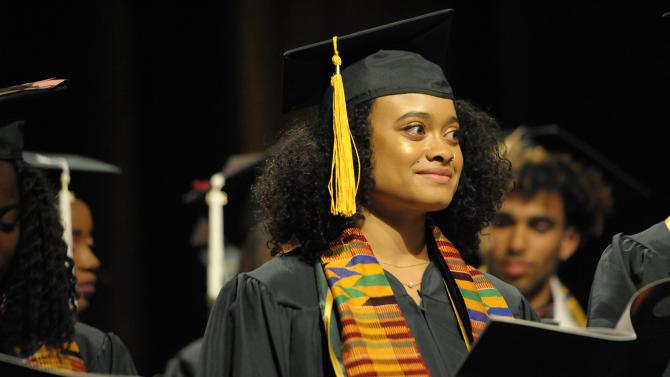 Student graduating at Black Commencement
