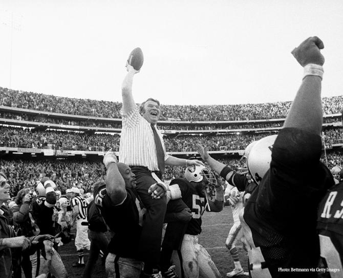 John Madden carried on field by teammates 