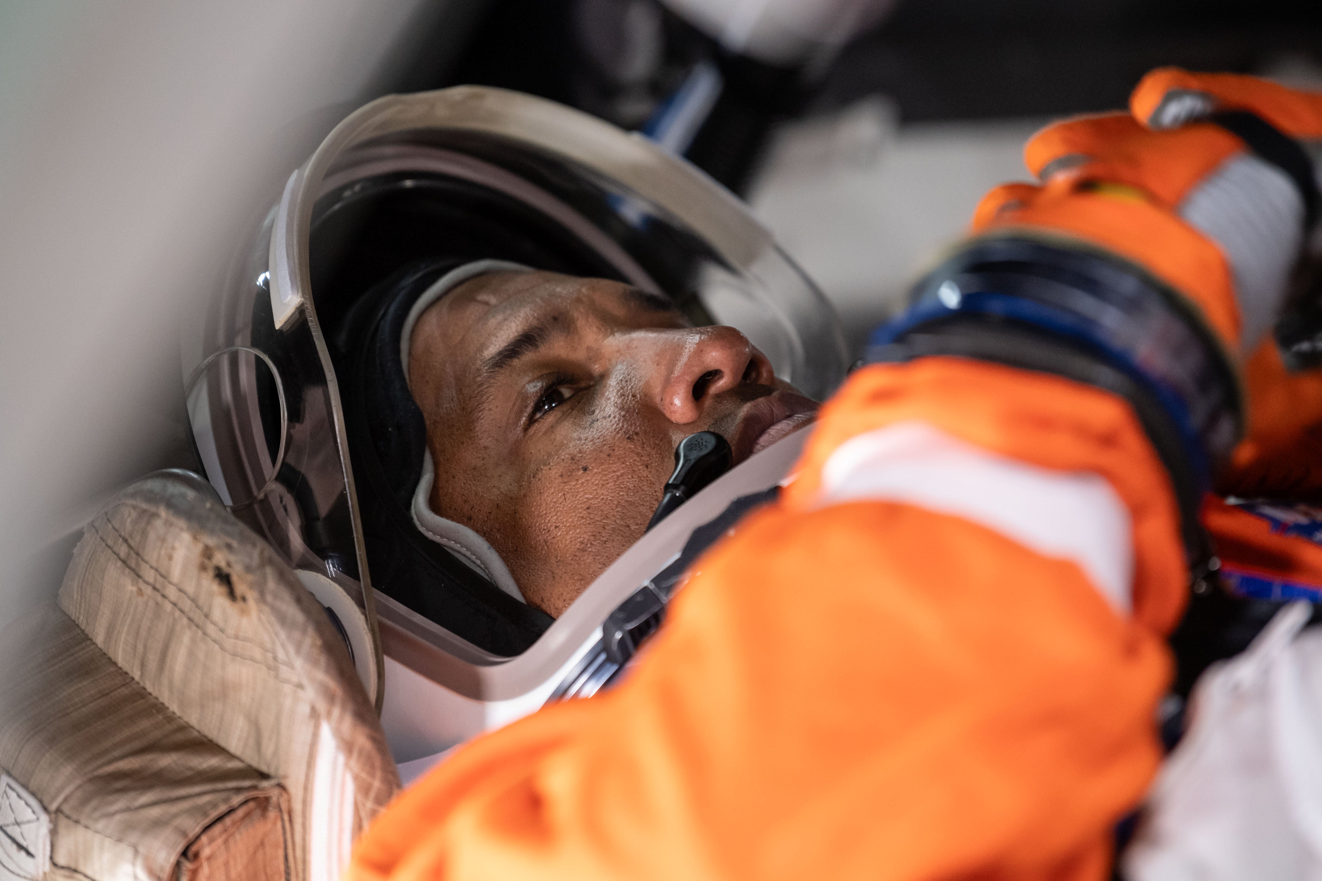 A closeup of astronaut Victor Glover in a space suit.