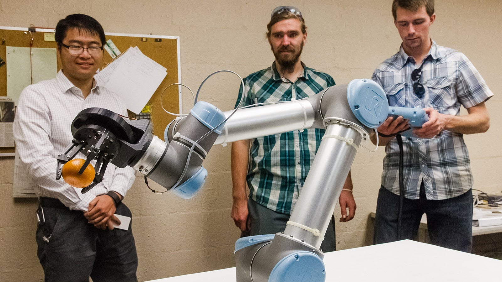 Students working with AG Robots