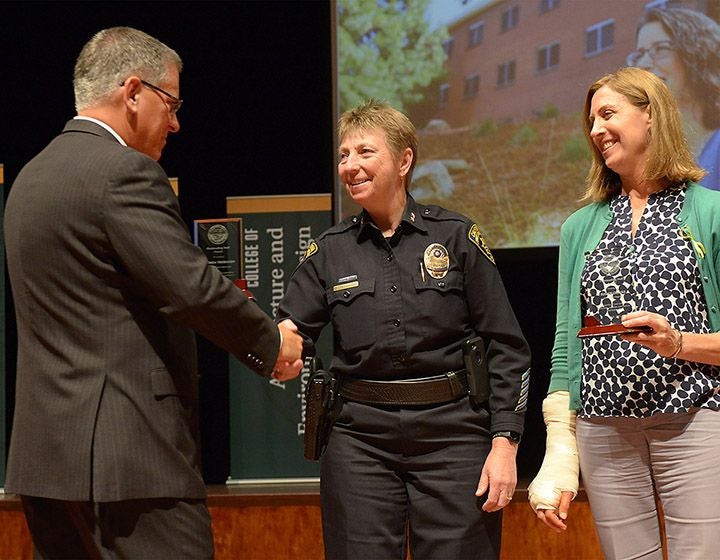 Brenda Trobaugh, center, receiving the Outstanding Staff Award.