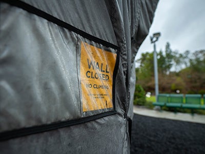 The ASI Poly Escapes Climbing Park in the rain with a closed sign.