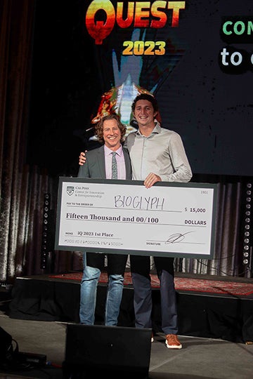 The BioGlyph team poses with a large check for winner the first-place prize of $15,000