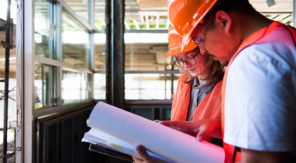 Construction manager looks over architectural plans