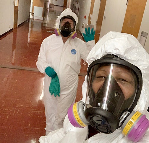 Christina Juarez, left, and Melonee Cruse of Cal Poly Environmental Health and Safety, respond to a report of a hazard on campus.