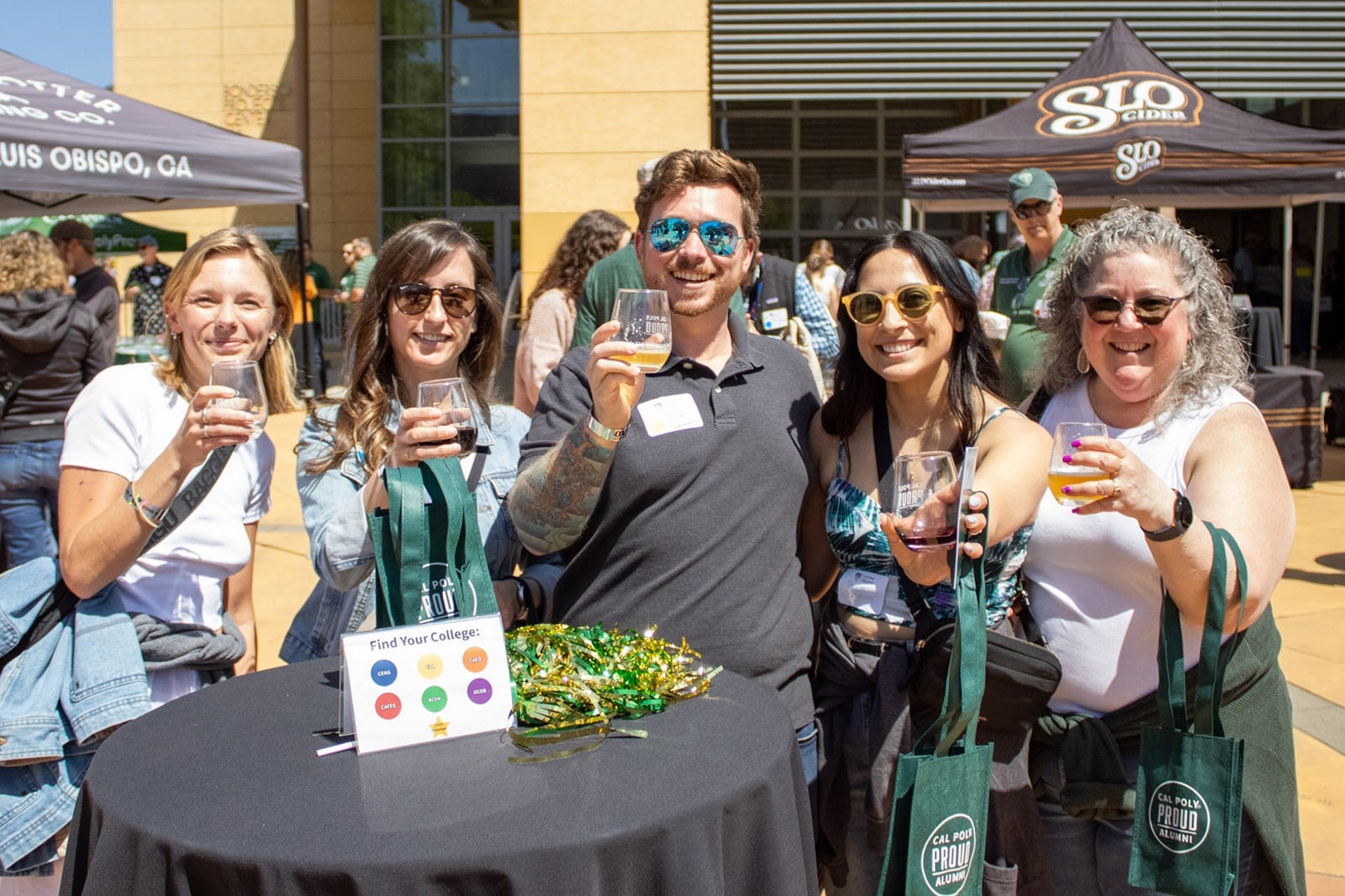 Attendees raise their glasses at a mixer on campus.