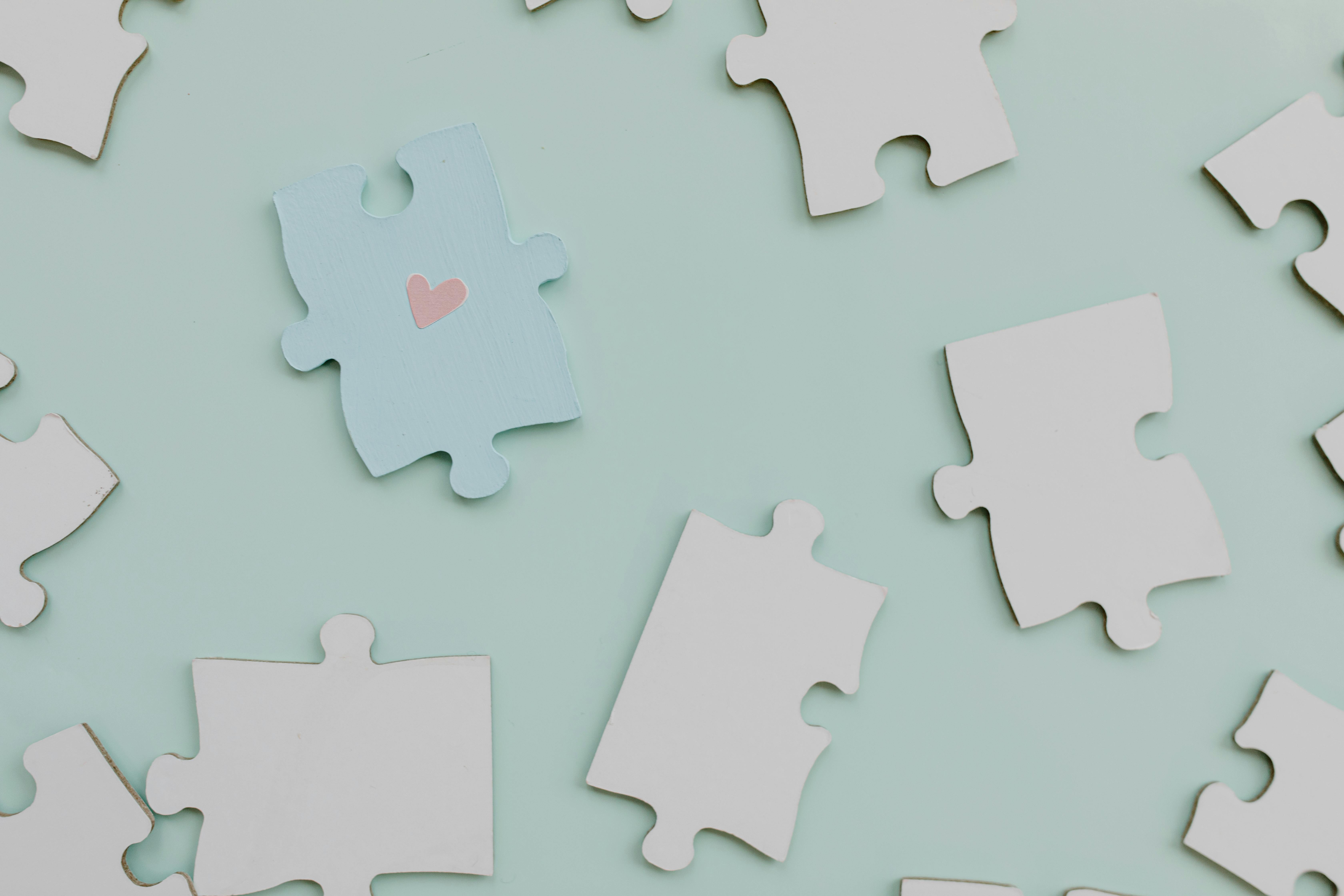 A graphic of puzzle pieces on a blue background. 