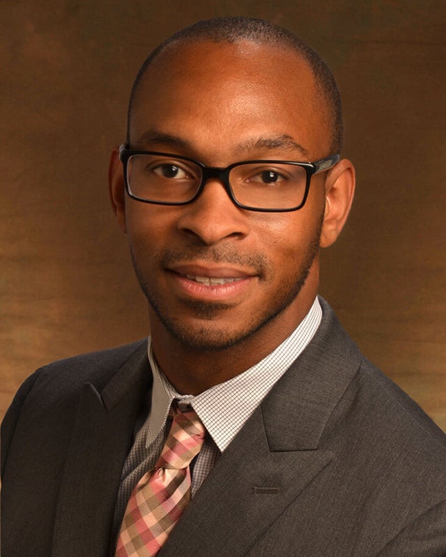 A headshot of Eric Espinoza-Wade.