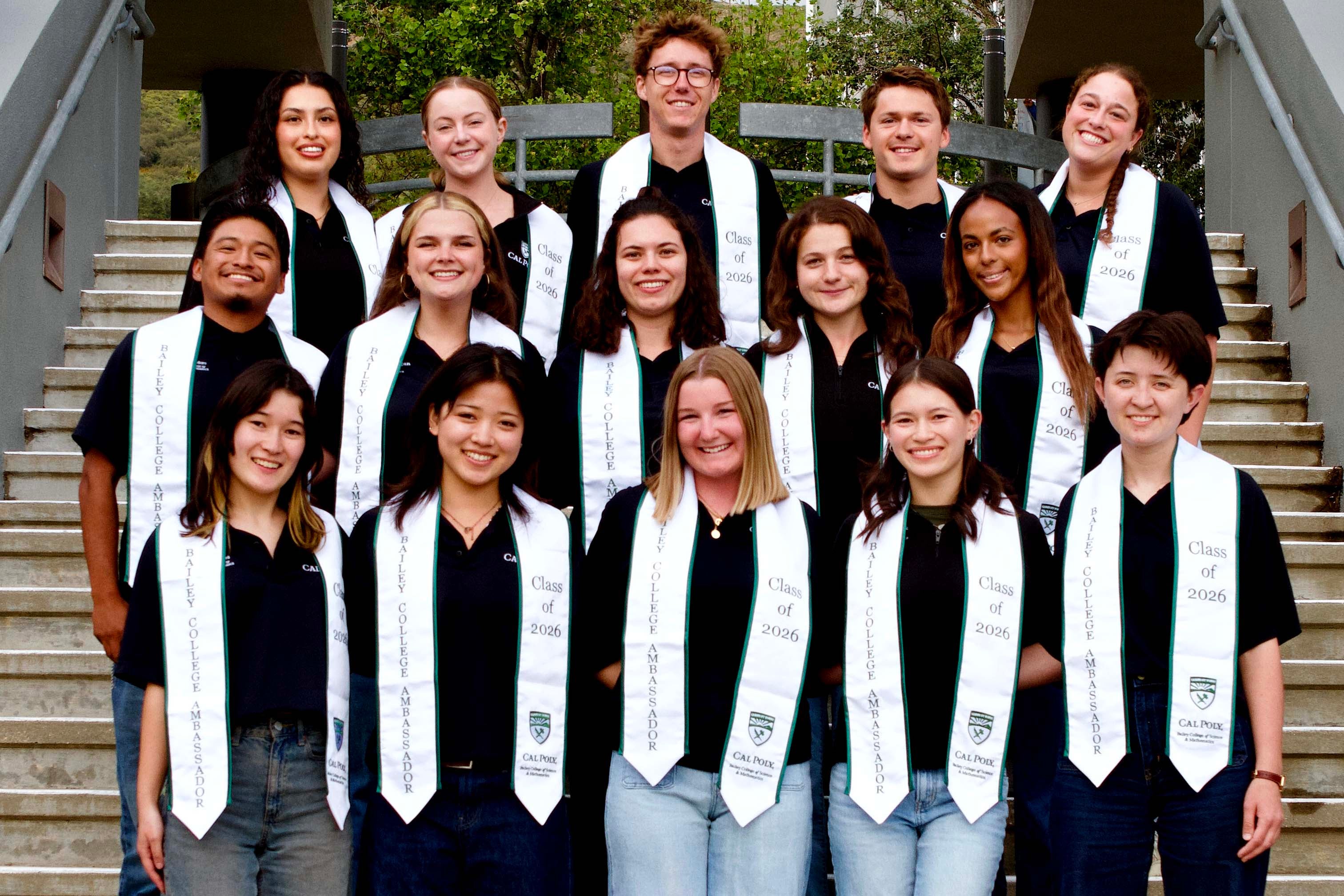 Rebeka Moges poses with other Bailey College ambassadors in their white graduation stoles.