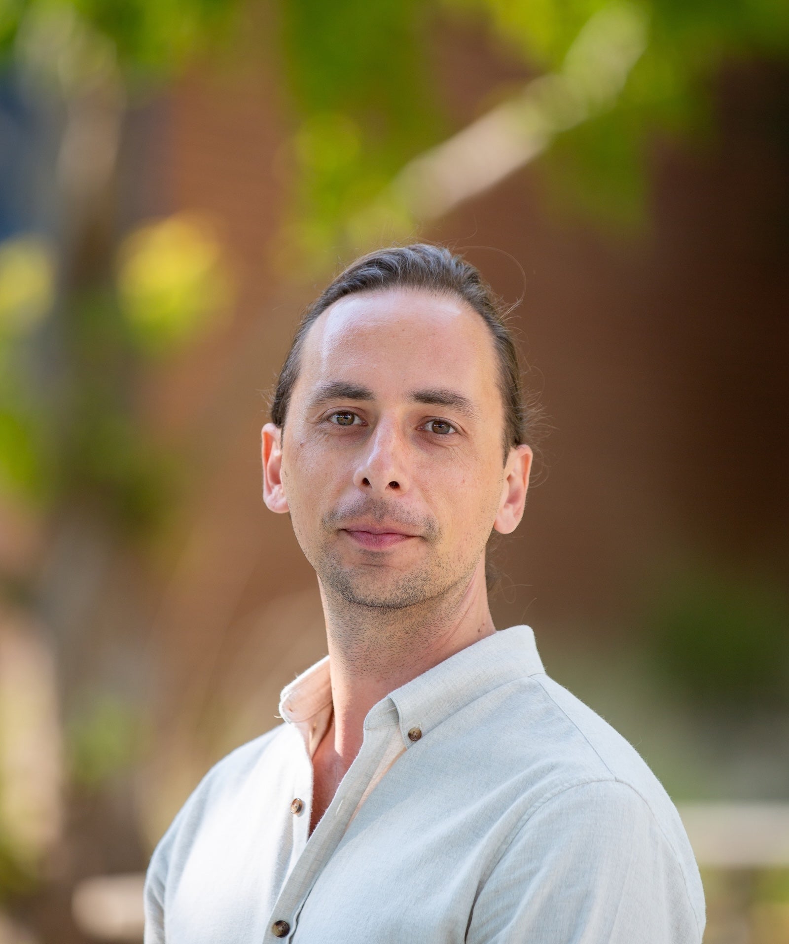 A portrait of professor Trevor Ruiz.