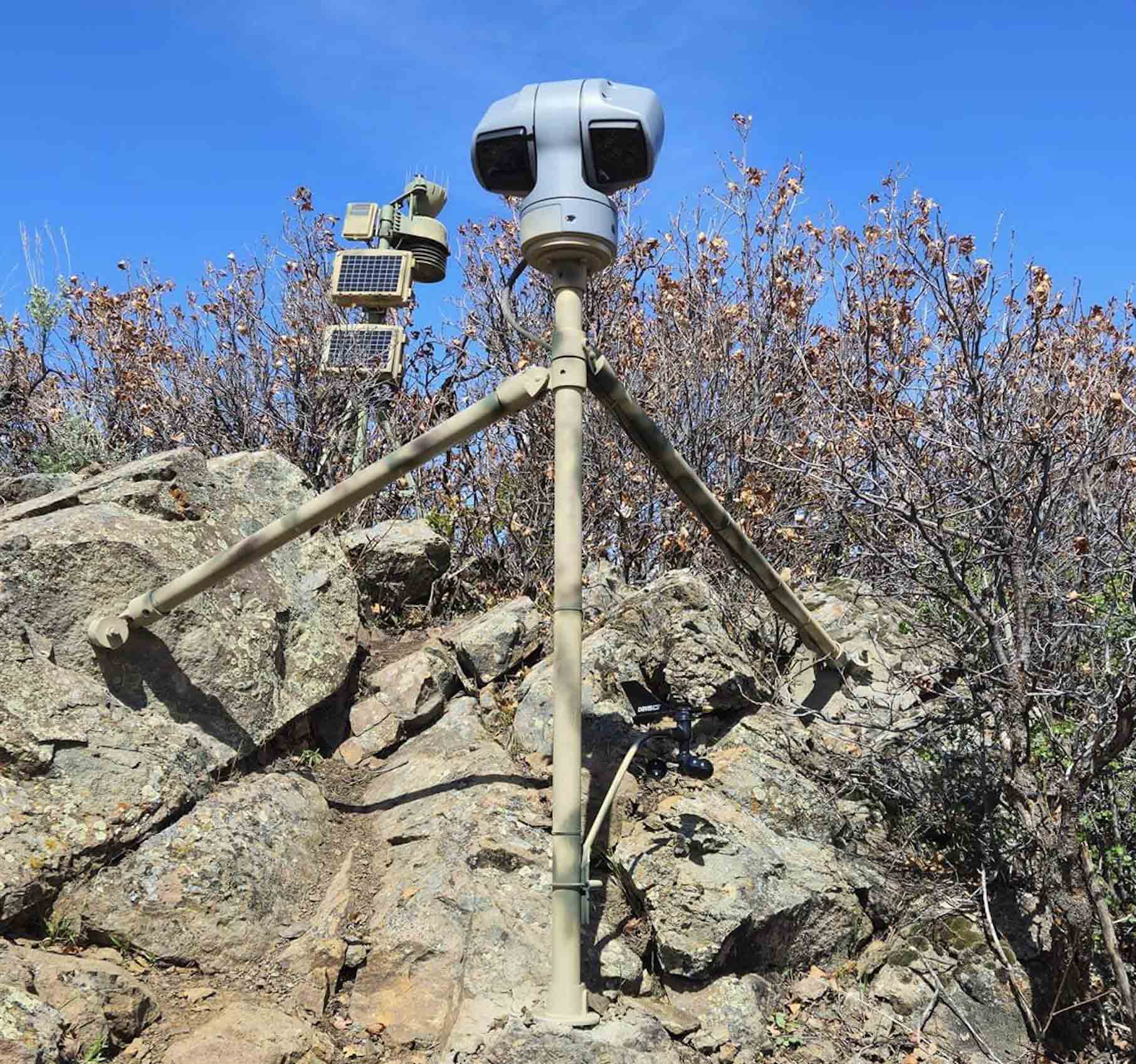 A weather station perched atop a rocky outcropping.
