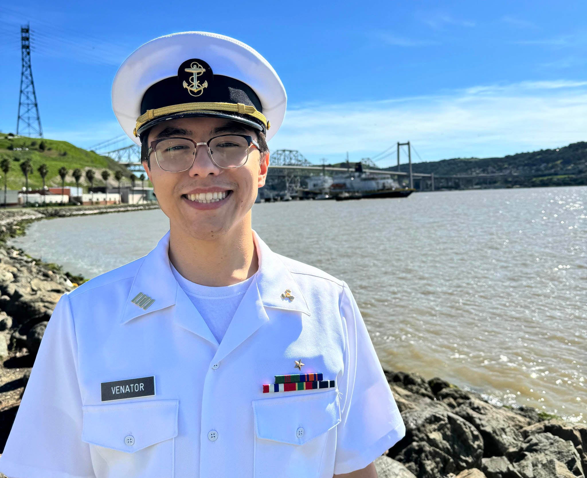 Tyler Venator smiles next to the water's edge in Vallejo.