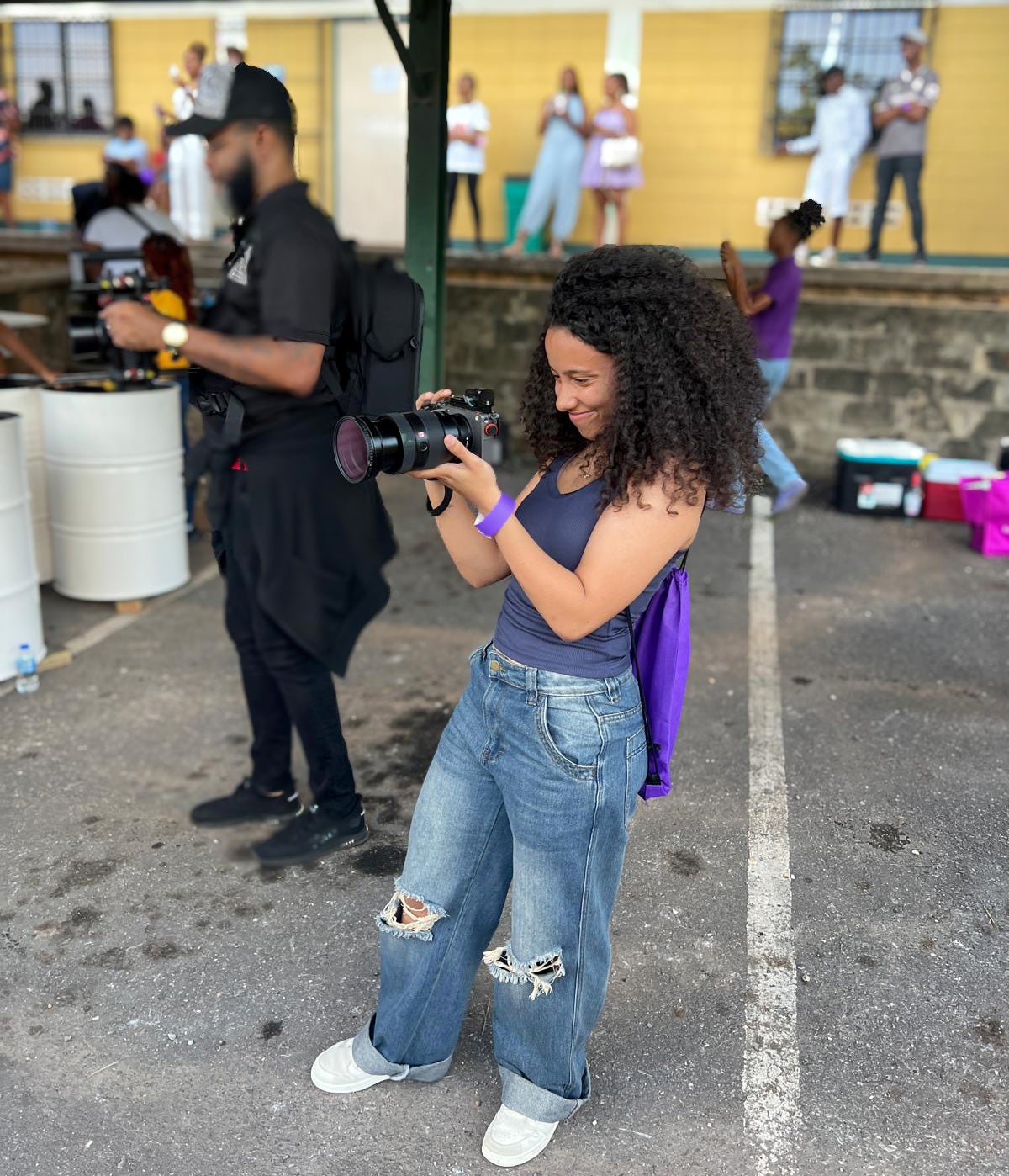 Alexis Wong holds a camera.