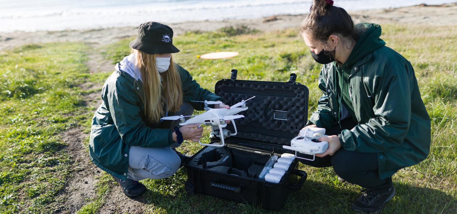 Graduate students Kate Riordan and Molly Murphy start setting up the aerial drone for surveys. NMFS permit #22187-02